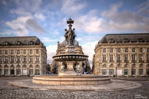 Discover the Fontaine des Trois Grâces at Place de la Bourse, a Bordeaux landmark with rich history, mythological figures, and riverside charm
