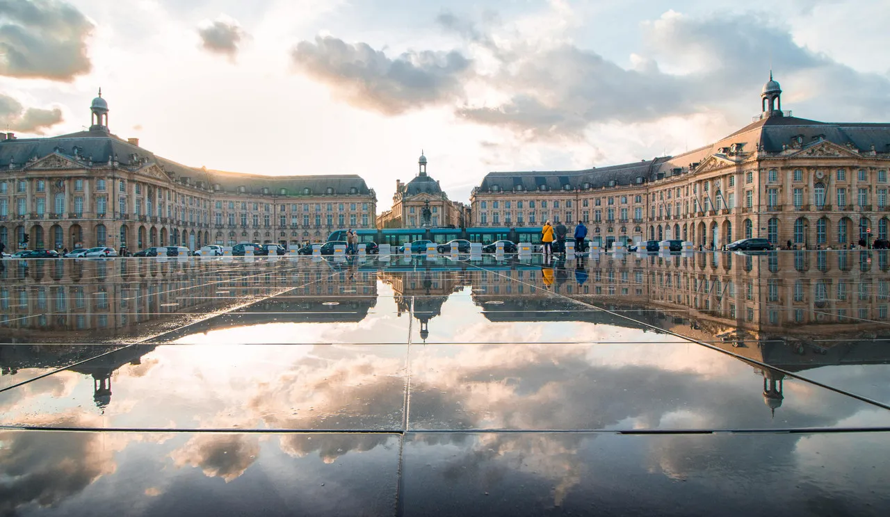 Place de la Bourse in Bordeaux with reflection on the Miroir d'eau at sunset